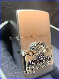 Zippo 2000 Formula One US Grand Prix Lighter with Box and Tin Unfired, Unopened